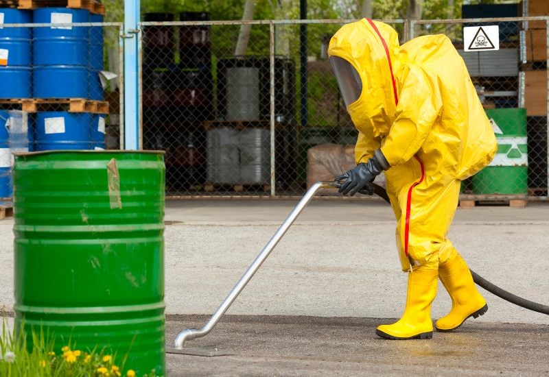 Workers in Protective Suits Cleaning Up a Chemical Spill in Houston, TX